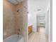 Updated bathroom showcasing a shower and tub combination with tile surround at 204 Lori Ct, Umatilla, FL 32784