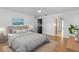 Staged bedroom with hardwood floors, an area rug, and neutral colors at 204 Lori Ct, Umatilla, FL 32784