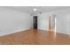 Bedroom featuring hardwood flooring and a doorway to the bathroom at 204 Lori Ct, Umatilla, FL 32784