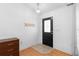 Foyer features updated floors, fresh paint, and access to other parts of the home at 204 Lori Ct, Umatilla, FL 32784