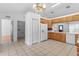 Traditional kitchen with wood cabinets, tile floors, and appliances at 204 Lori Ct, Umatilla, FL 32784