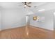 Living room featuring hardwood flooring with a pass through view to the kitchen at 204 Lori Ct, Umatilla, FL 32784