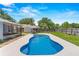 The refreshing in-ground pool is perfect for cooling off and entertaining in this backyard oasis at 204 Lori Ct, Umatilla, FL 32784