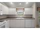 All white kitchen with ample countertop and cabinet space at 2207 Crawford Ct, The Villages, FL 32162