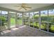 Enclosed patio offering views of the lush green landscape, creating a tranquil retreat at 2207 Crawford Ct, The Villages, FL 32162