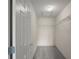 A well-organized walk-in closet features carpeted flooring, white walls, and metal shelving for ample storage at 2207 Crawford Ct, The Villages, FL 32162
