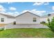 Well-maintained backyard with grass, providing a relaxing outdoor space for leisure and entertainment at 2237 Jetta Way, The Villages, FL 32162