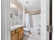Functional bathroom with a tub/shower combo, vanity, and a toilet, offering a practical space at 2237 Jetta Way, The Villages, FL 32162
