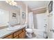 Bright bathroom includes a tub/shower and vanity, offering convenience at 2237 Jetta Way, The Villages, FL 32162