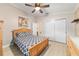 Comfortable bedroom offers a ceiling fan and closet, providing a relaxing space at 2237 Jetta Way, The Villages, FL 32162