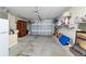 Spacious garage with ample storage, a garage door, and plenty of room at 2237 Jetta Way, The Villages, FL 32162