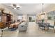 Open-concept space featuring a dining table, seating, and sliding door to the outdoors at 2237 Jetta Way, The Villages, FL 32162