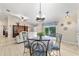 Bright living area showcasing the dining space, comfortable seating, and access to the outdoor patio, perfect for entertaining at 2237 Jetta Way, The Villages, FL 32162