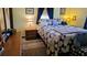 Inviting bedroom featuring a patchwork quilt and soft, ambient lighting at 235 Rockmoore Ct, Deland, FL 32720