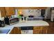 Kitchen area with view to adjacent living room at 235 Rockmoore Ct, Deland, FL 32720
