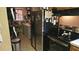 Functional kitchen with stainless steel appliances and space-saving storage solutions at 235 Rockmoore Ct, Deland, FL 32720