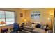 Well-lit living room featuring a comfortable sectional sofa and bright, airy atmosphere at 235 Rockmoore Ct, Deland, FL 32720