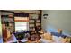 Relaxing living room with a sofa, shelving, decorations, and a window at 235 Rockmoore Ct, Deland, FL 32720