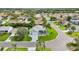 Aerial shot of a well-maintained home with a spacious yard in a serene residential neighborhood at 2455 Five Forks Trl, The Villages, FL 32162