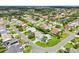 Overview of a neighborhood with neatly maintained lawns and various home styles at 2455 Five Forks Trl, The Villages, FL 32162