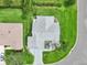An aerial view showcases the home's roof, landscaped yard, and proximity to neighborhood streets at 2455 Five Forks Trl, The Villages, FL 32162