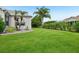 An expansive green backyard offers ample space for outdoor activities and landscaping opportunities at 2455 Five Forks Trl, The Villages, FL 32162