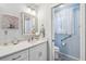 Well-lit bathroom featuring a white vanity, silver framed mirror, and toilet room at 2455 Five Forks Trl, The Villages, FL 32162