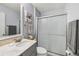 Clean bathroom with a glass-enclosed shower and a gray vanity with a white countertop at 2455 Five Forks Trl, The Villages, FL 32162