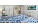 Comfortable bedroom with a bed and large closet, and a view into another room at 2455 Five Forks Trl, The Villages, FL 32162