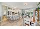 Spacious kitchen featuring an island with seating, stainless appliances, and modern lighting at 2455 Five Forks Trl, The Villages, FL 32162
