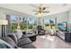 Inviting living room with abundant natural light and comfortable seating arrangement at 2455 Five Forks Trl, The Villages, FL 32162