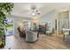 Bright and airy living room boasting stylish decor, neutral tones, and wood flooring at 2455 Five Forks Trl, The Villages, FL 32162