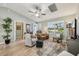 Cozy primary bedroom with ample natural light, seating, and modern decor at 2455 Five Forks Trl, The Villages, FL 32162