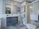 Modern bathroom with sleek vanity, updated fixtures, and glass-enclosed shower stall at 25007 Bellevue, Leesburg, FL 34748