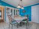 Dining room with bright-colored walls, matching chairs, and a chandelier at 25007 Bellevue, Leesburg, FL 34748