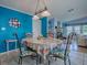 Dining room with bright-colored walls and matching chairs that is close to the living room at 25007 Bellevue, Leesburg, FL 34748