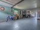 Spacious garage with ample storage space, a tricycle, and plenty of room for vehicles or projects at 25007 Bellevue, Leesburg, FL 34748