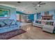 Spacious living room featuring hardwood floors and bright-colored walls that leads into the dining room at 25007 Bellevue, Leesburg, FL 34748