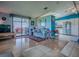 Cozy living room adjacent to kitchen and screened patio, offering great natural light and comfortable seating at 25007 Bellevue, Leesburg, FL 34748