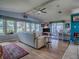 Comfortable living room with large windows, ceiling fan, and stylish decor at 25007 Bellevue, Leesburg, FL 34748