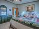 This is a well-lit bedroom with a ceiling fan, picture, nice furniture, and a comfortable bed at 25007 Bellevue, Leesburg, FL 34748