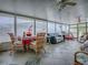 Bright sunroom with tile floors, multiple ceiling fans, and plenty of natural light at 25007 Bellevue, Leesburg, FL 34748