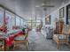 Comfortable sunroom with tile floors, ceiling fans, and comfortable seating with views of the outdoors at 25007 Bellevue, Leesburg, FL 34748