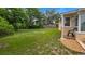 Expansive backyard featuring lush green grass and a partially shaded area for outdoor enjoyment at 256 Carroll St, Clermont, FL 34711