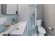 Modern bathroom featuring a stylish vanity, glass-enclosed shower, and sleek fixtures at 256 Carroll St, Clermont, FL 34711