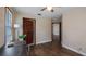 Bedroom featuring hardwood floors, a ceiling fan and lots of natural light at 256 Carroll St, Clermont, FL 34711