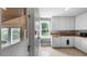 Functional kitchen featuring white cabinets, stainless steel appliances, and a view of the outdoors at 256 Carroll St, Clermont, FL 34711