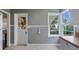 Bright kitchen featuring neutral tones, modern appliances, and an adjacent door to a sunroom at 256 Carroll St, Clermont, FL 34711