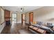 Inviting living room with hardwood floors, a cozy fireplace, and comfortable seating at 256 Carroll St, Clermont, FL 34711