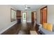 Comfortable living room with hardwood floors, fireplace, and ample natural light from the windows at 256 Carroll St, Clermont, FL 34711